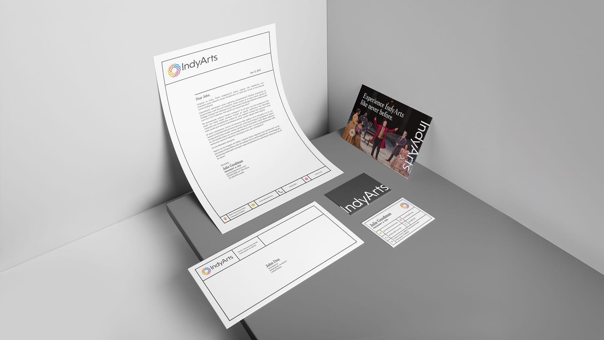 IndyArts stationery set with letterhead, envelope, business cards and a performance postcard