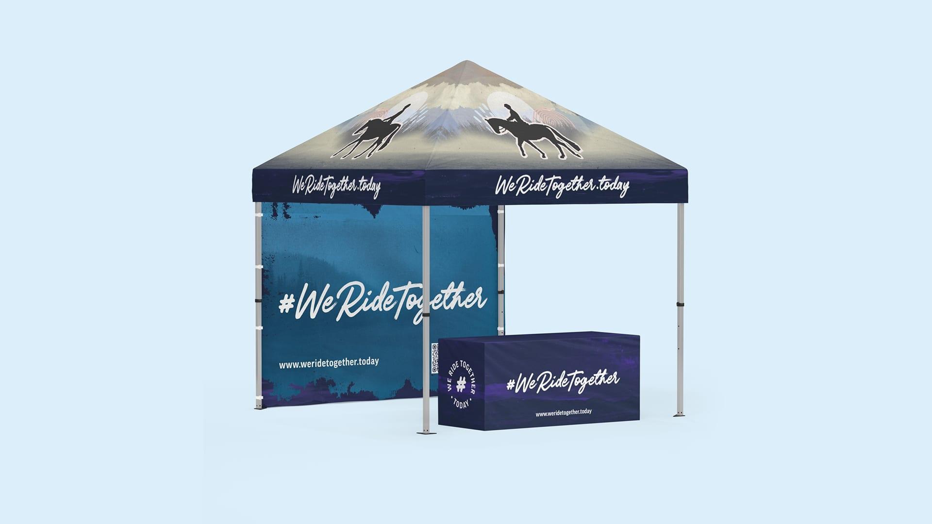 Branded #WeRideTogether event tent and matching table cover