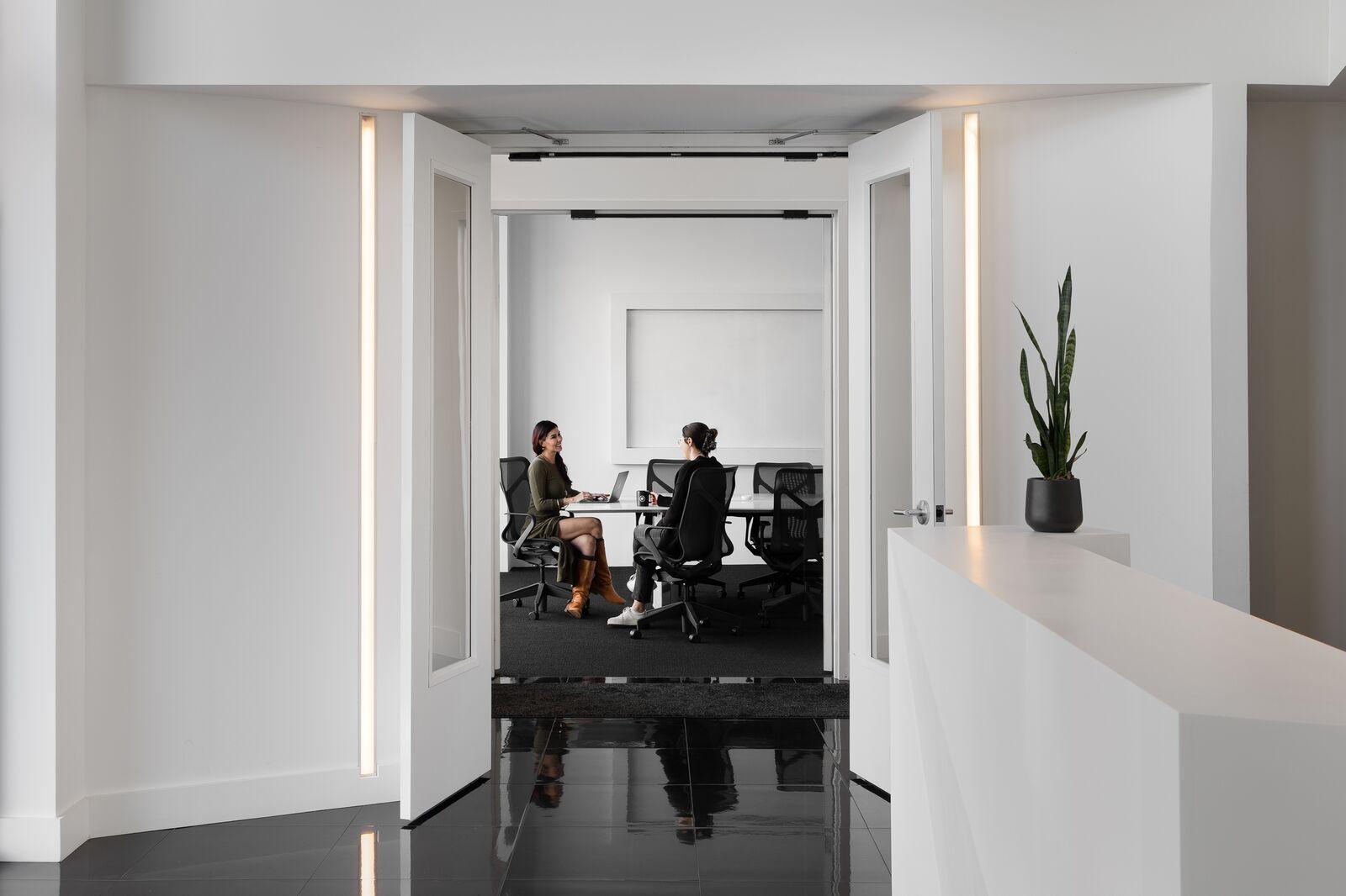 Two RedTag team members working in the studio
