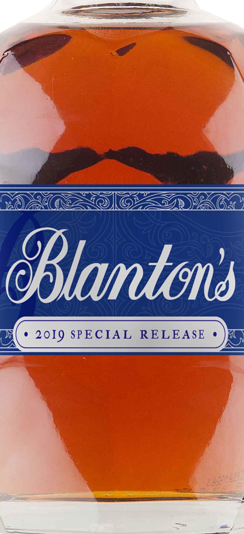 Close-up of three Blanton's bottles showing the blue 2019 Special Release label with the Blanton's script logo