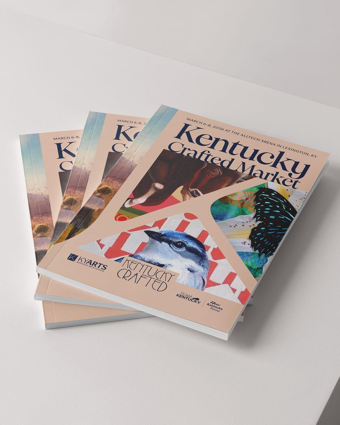 Stack of Kentucky Crafted Market catalogs with an illustrated bird cover